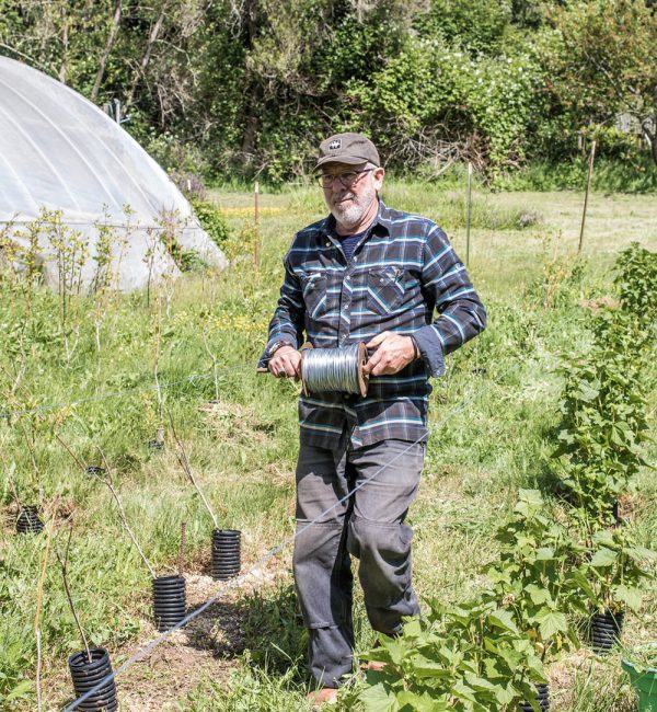 Riley Starks builds a frame for the plants